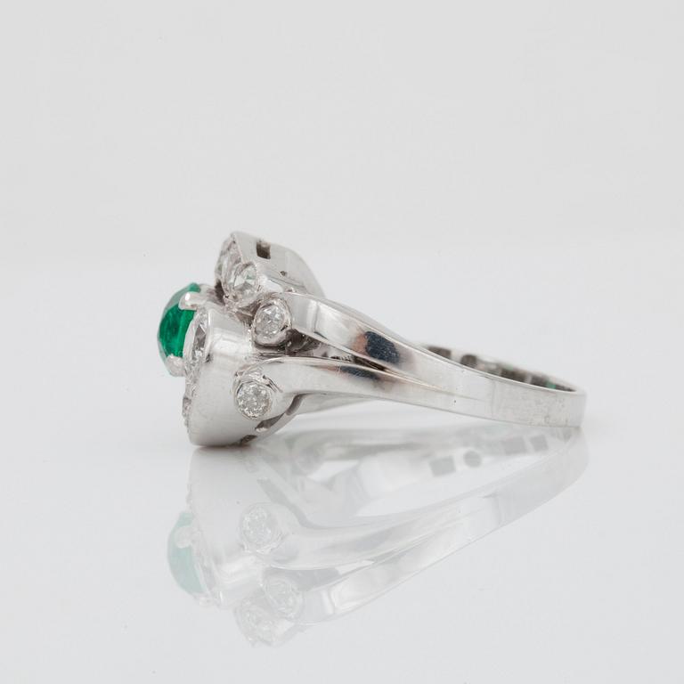 An emerald and brilliant-cut diamond ring. Total carat weight of diamonds circa 1.10 cts.