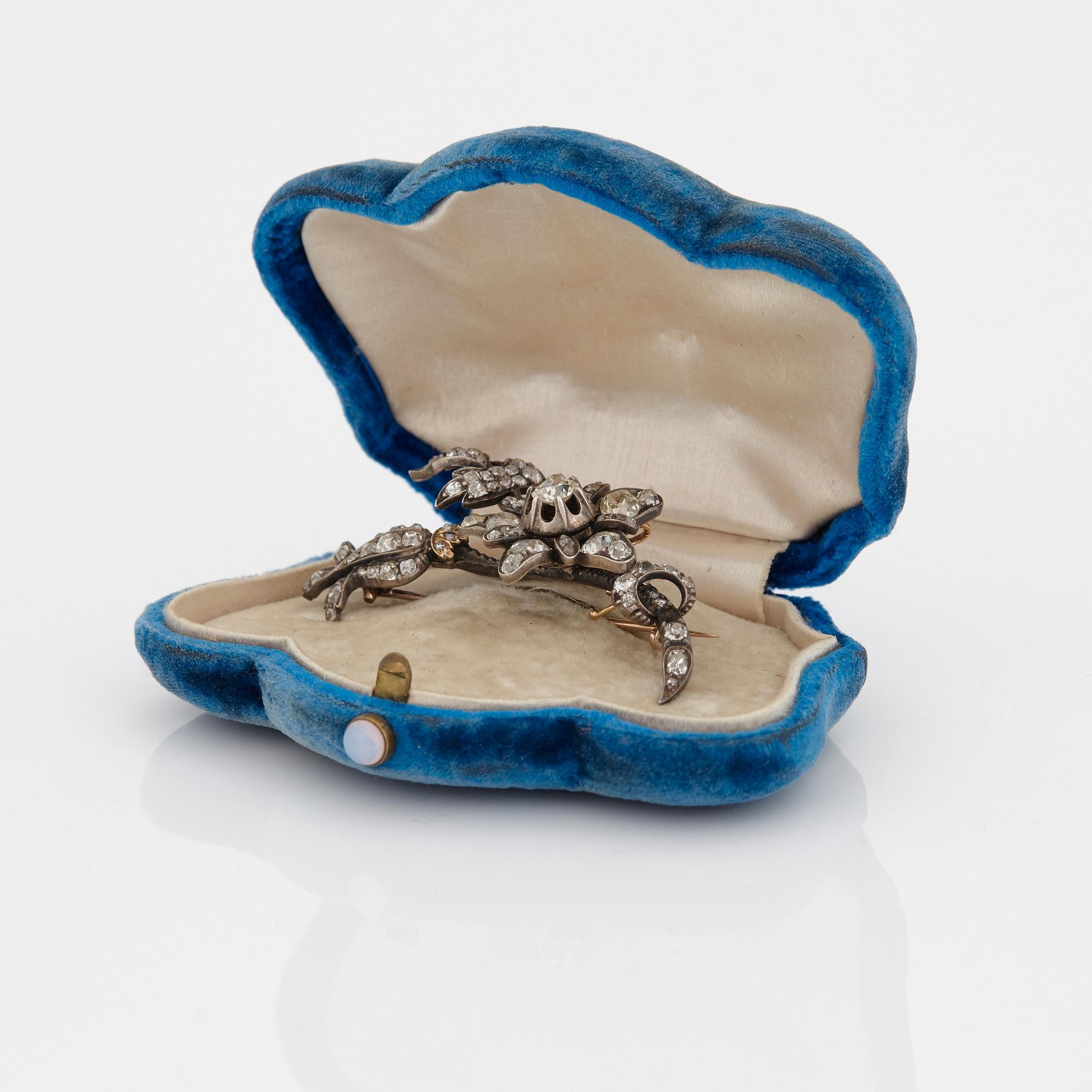 A BROOCH set with old-cut diamonds.