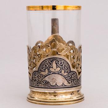 A Russian silver teaglass holder and seven teaspoons, Moscow and Kiev, first half and mid-20th Century.