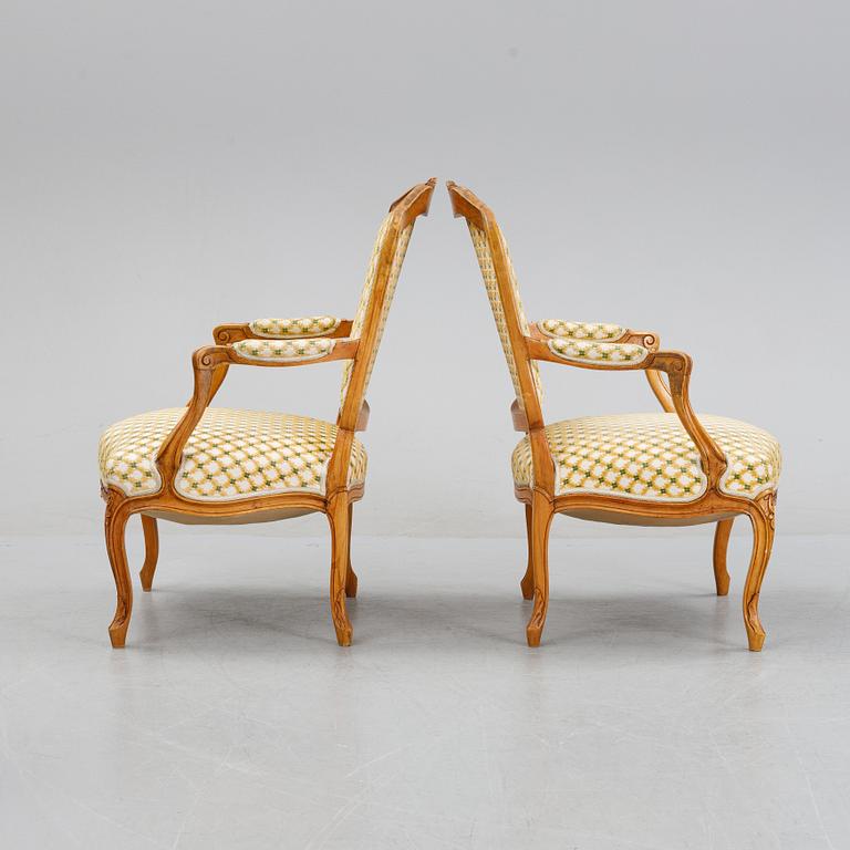 A pair of rococo style armchairs, early 20th Century.