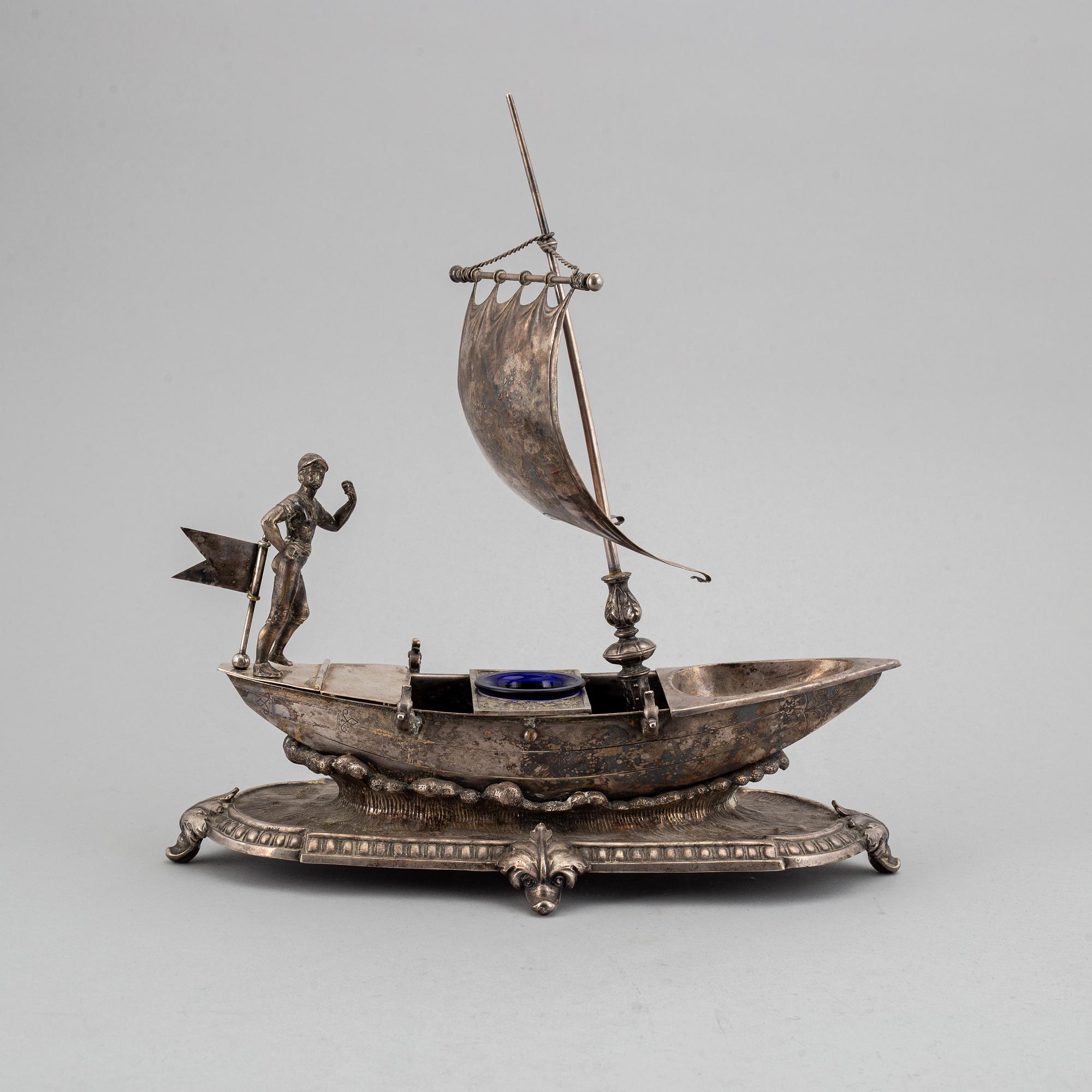 A silver plated inkwell, circa 1900.