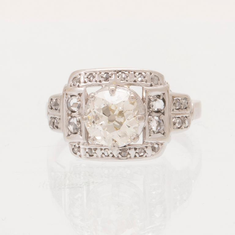 An 18K white gold ring set with an old cut diamond and rose cut diamonds.