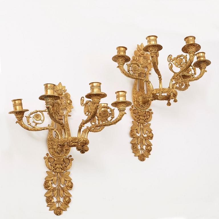 A pair of French 19th century gilt bronze five-light wall-lights.