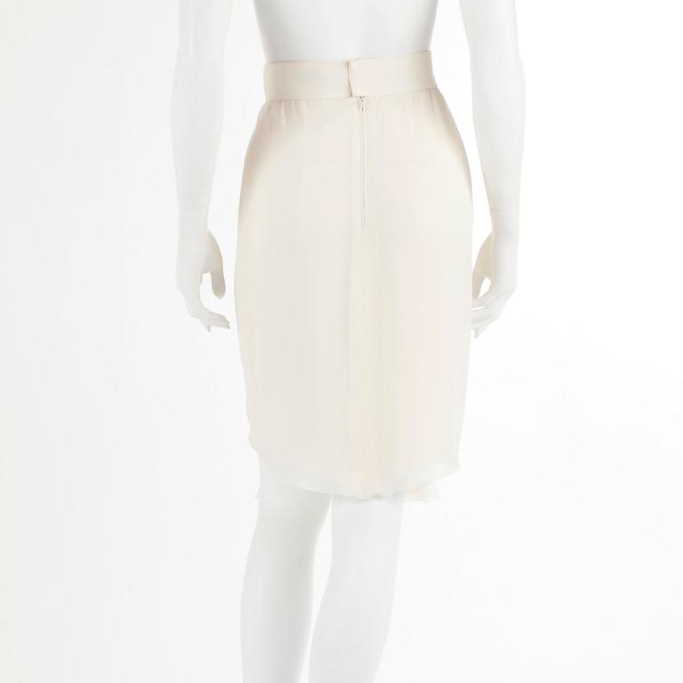 CHANEL, a bonewhite silk skirt. French size 40.