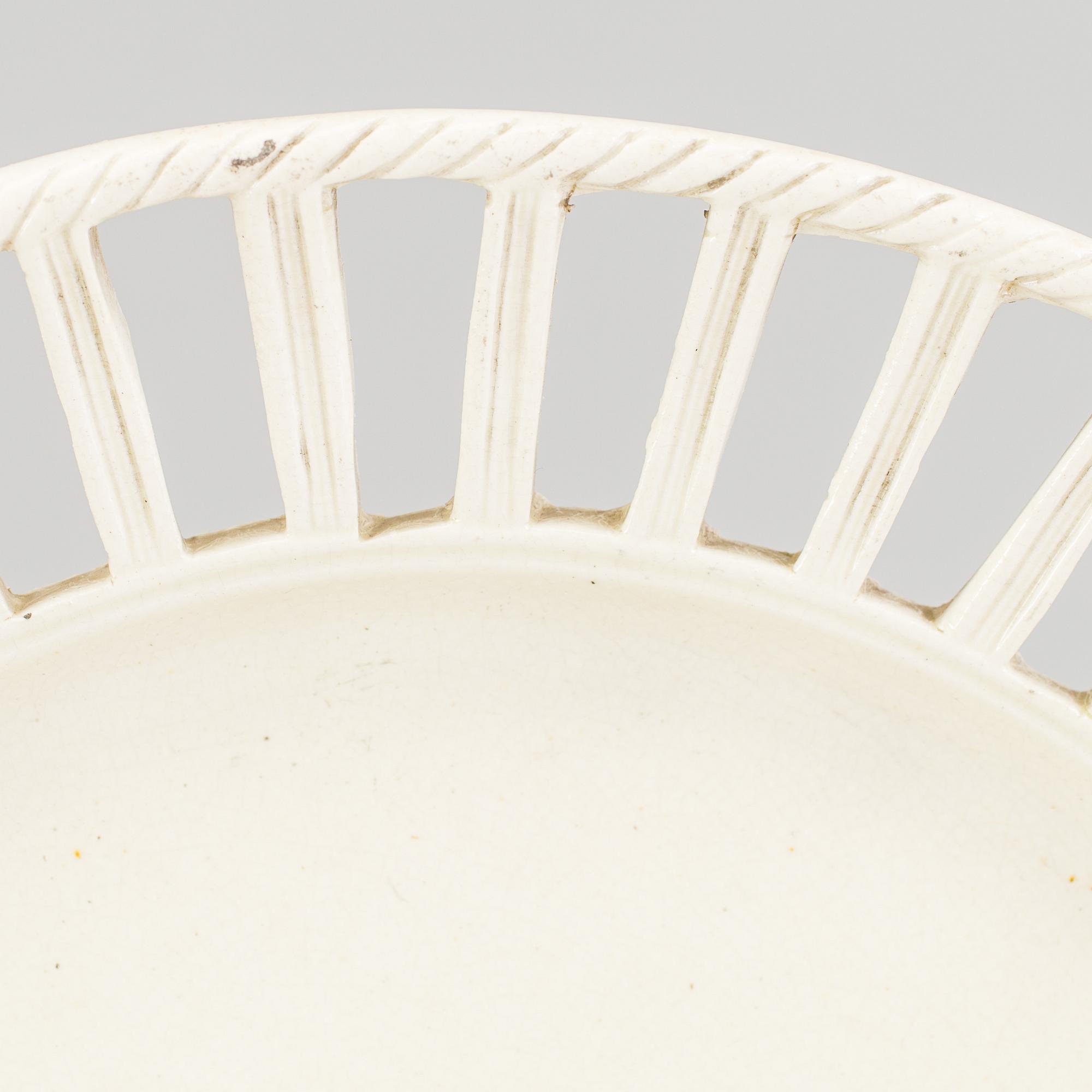 TWO CREAMWARE PLATES, one marked Wedgwood, first half of the 19th century and late 18th century.