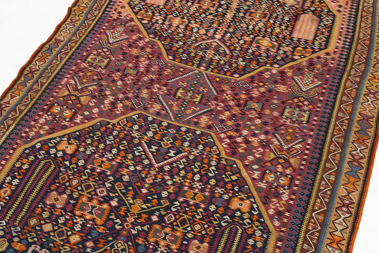 An antique kilim, southeastern Anatolia/Caucasus, c. 398 x 176 cm.