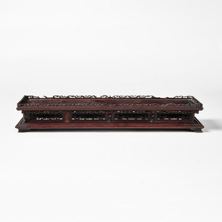 A Chinese hardwood stand, Qing dynasty, 19th century.