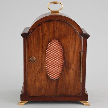 A table ckock by Elliot from London in the 20th century.