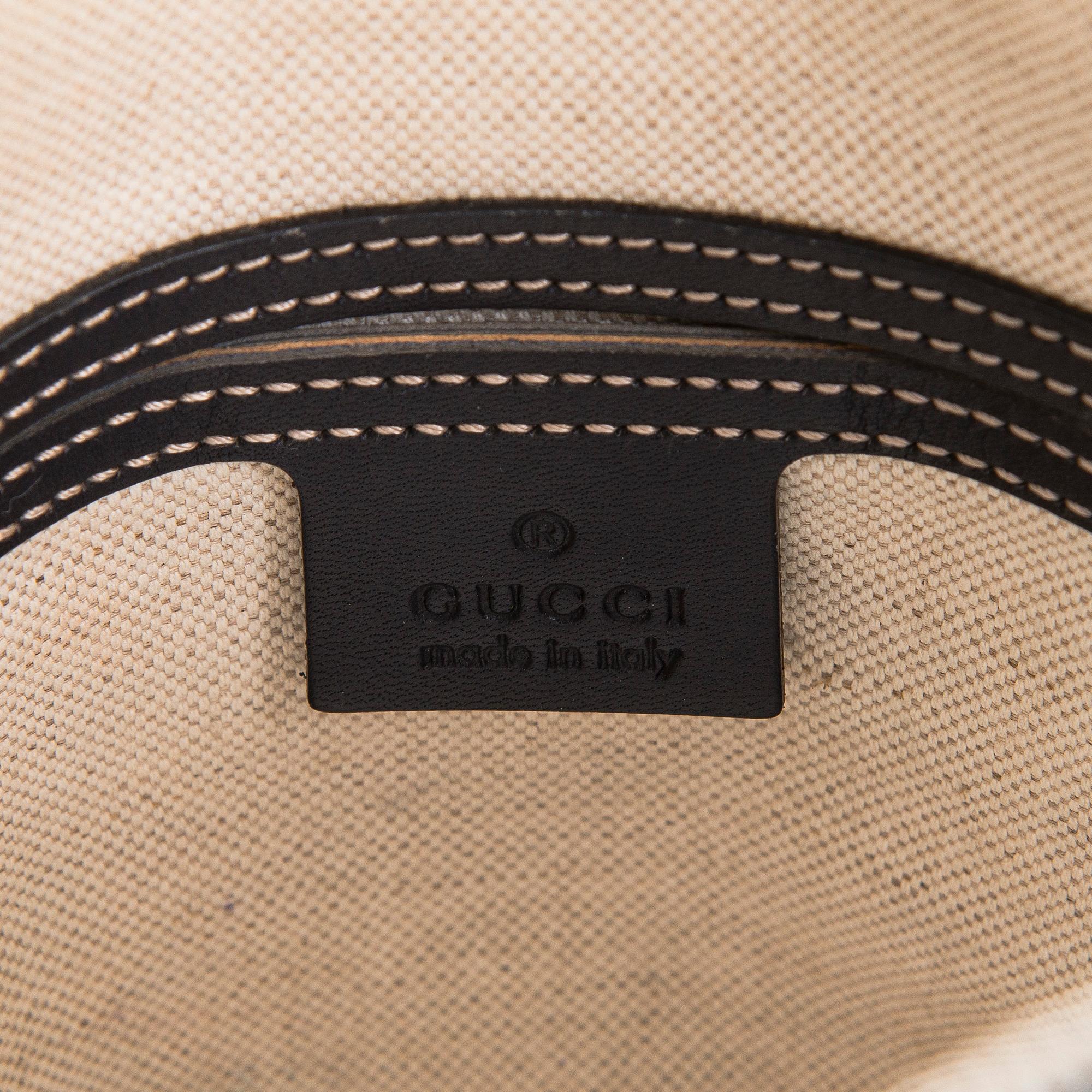 Gucci, A "GG Supreme messenger" bag.