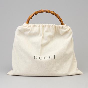 A Gucci leather bag.