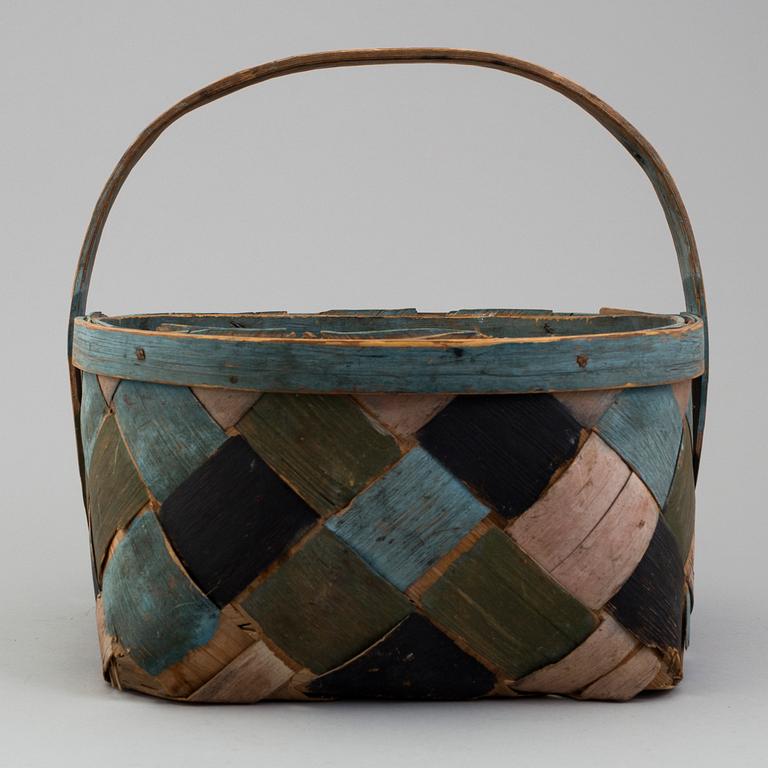 a painted basket from the 19th century.