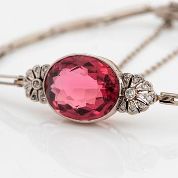 An 18K gold bracelet set with a faceted pink tourmaline weight ca 6.00 cts.