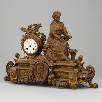 A  French 19th century mantle clock in Louis-XVI style.