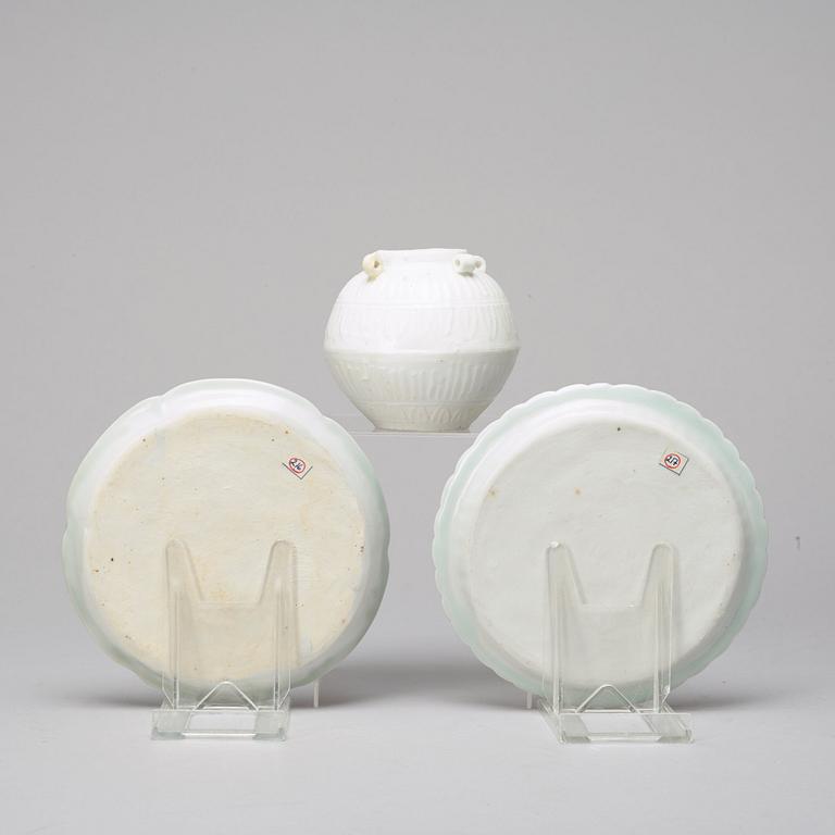 Two celadon glazed dishes and a white glazed jar, South East Asia, presumably 12th/17th Century.