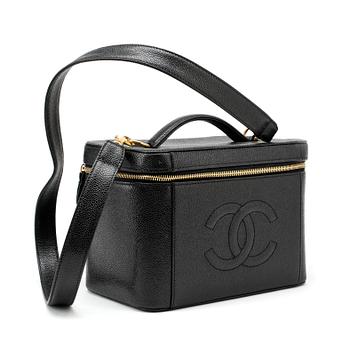 499. CHANEL, a black caviar leather beauty case.