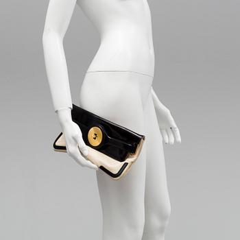 A black and white leather clutch by Balenciaga.