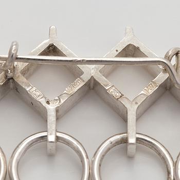 Jorma Laine, a set of two silver pendants, a bracelet and a brooch. Kultateollisuus Oy, Turku 1965-1972.