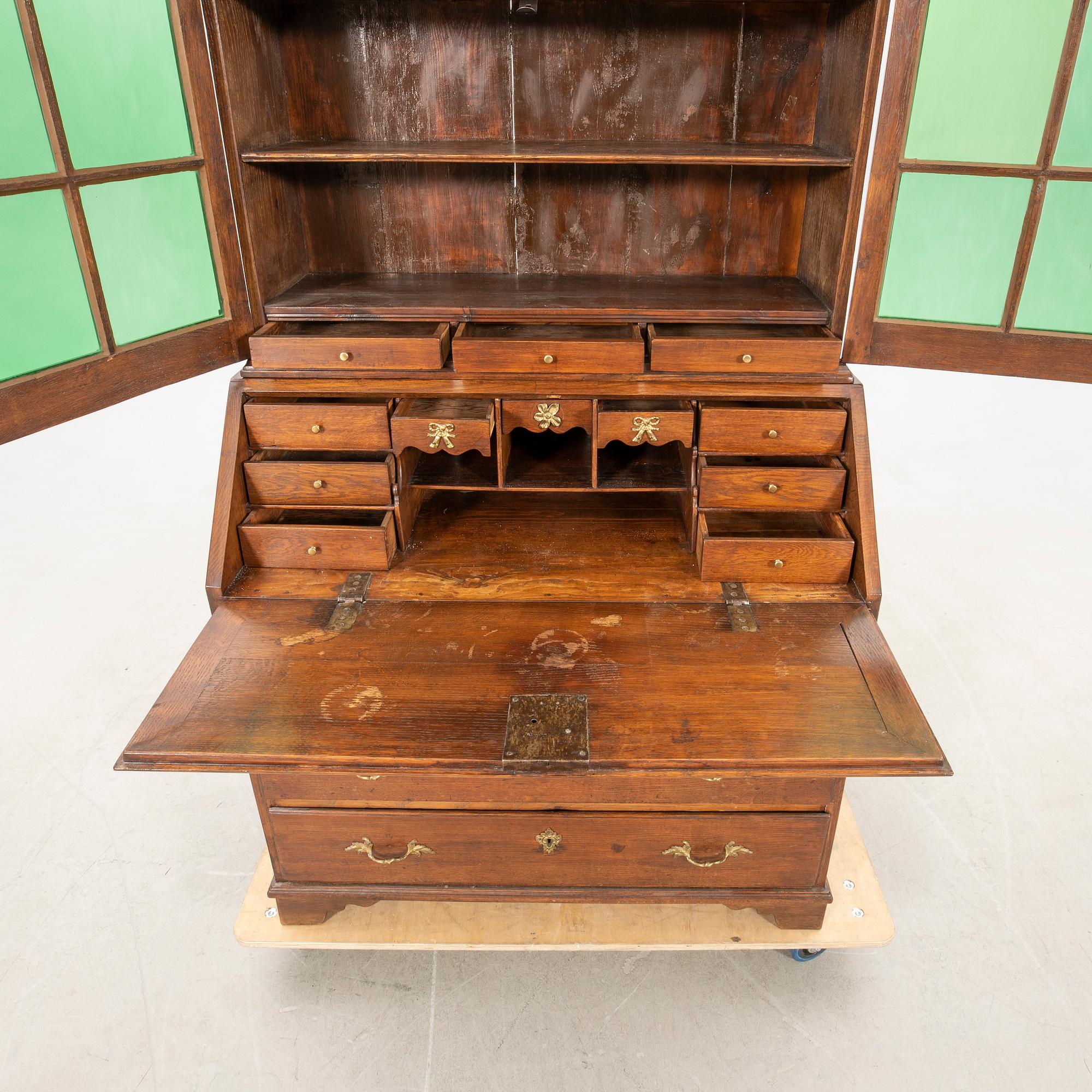 Slant-front secretary with a glazed section, 18th century.