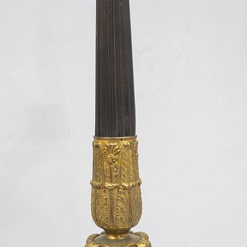 A pair of French Empire-style patinated and gilt bronze five-light candelabra, later part 19th century.