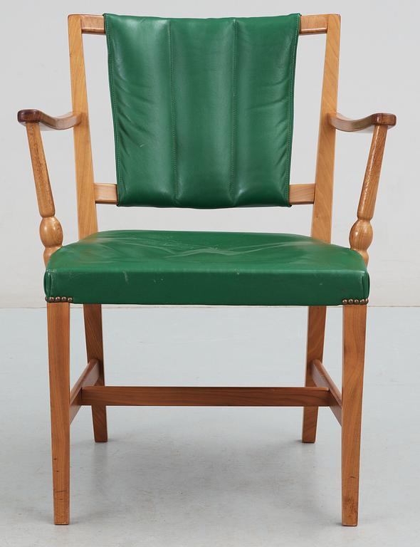 A Josef Frank mahogany and green leather armchair.