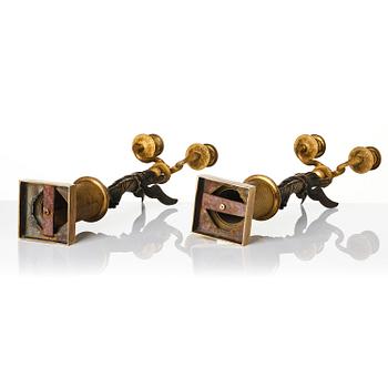 A pair of gilt and patinated bronze Empire-style two branch candelabra, later part 18th century.