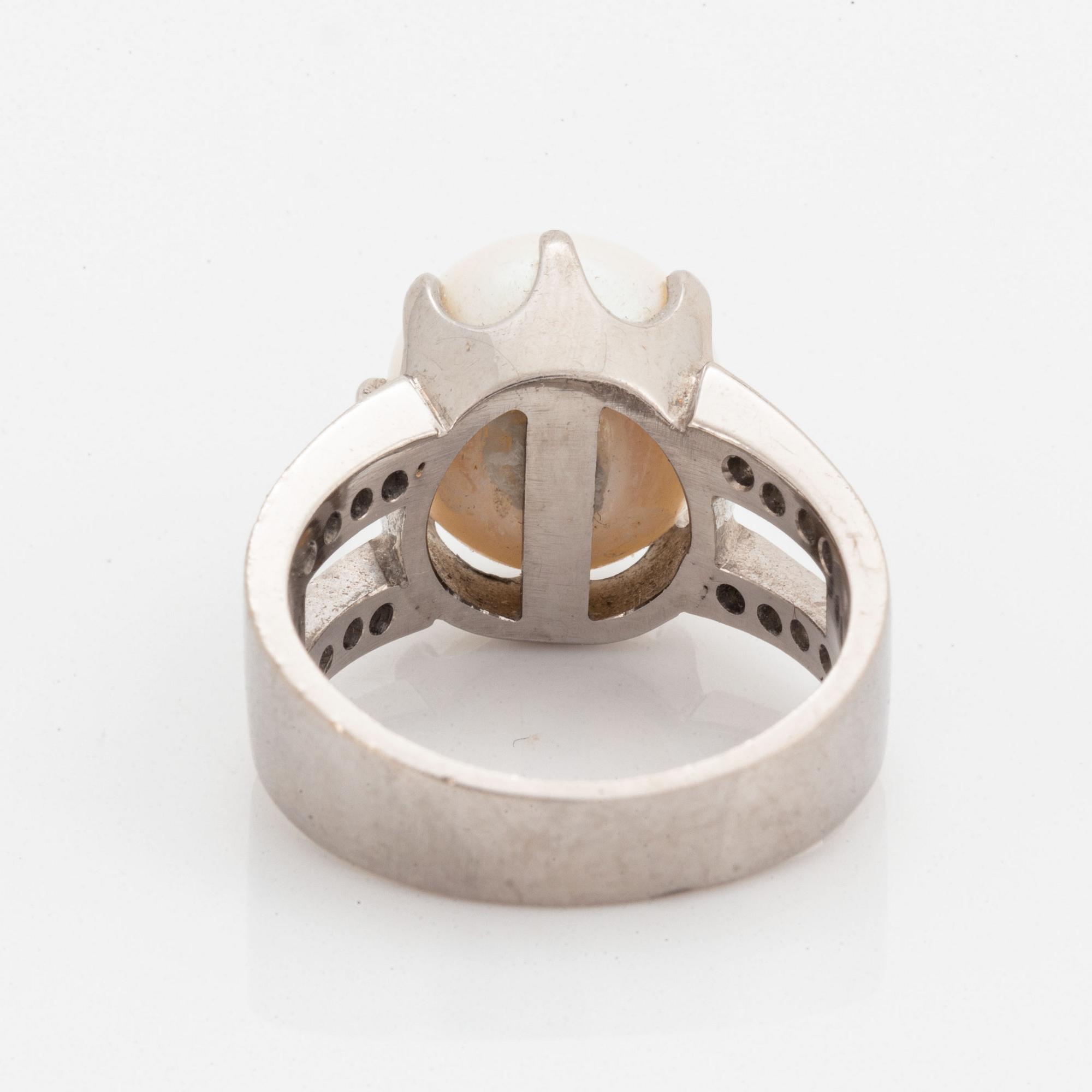 Cultured pearl and brilliant-cut diamond ring.