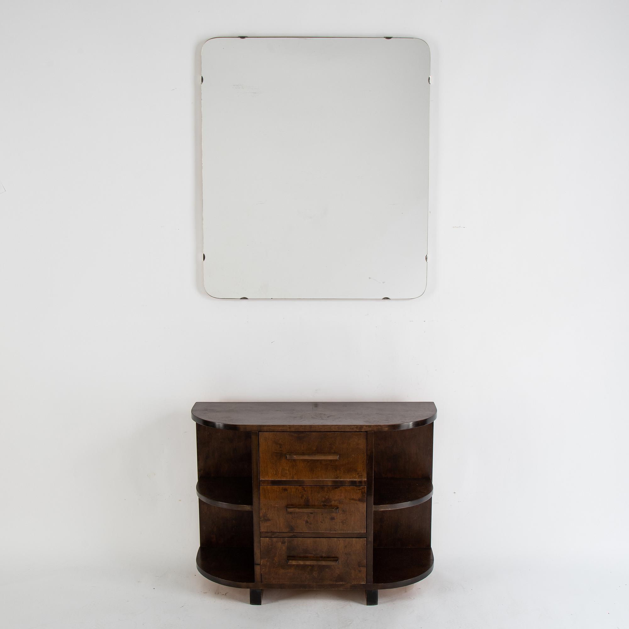 A stained birch chest of drawers and mirror, 1930's.