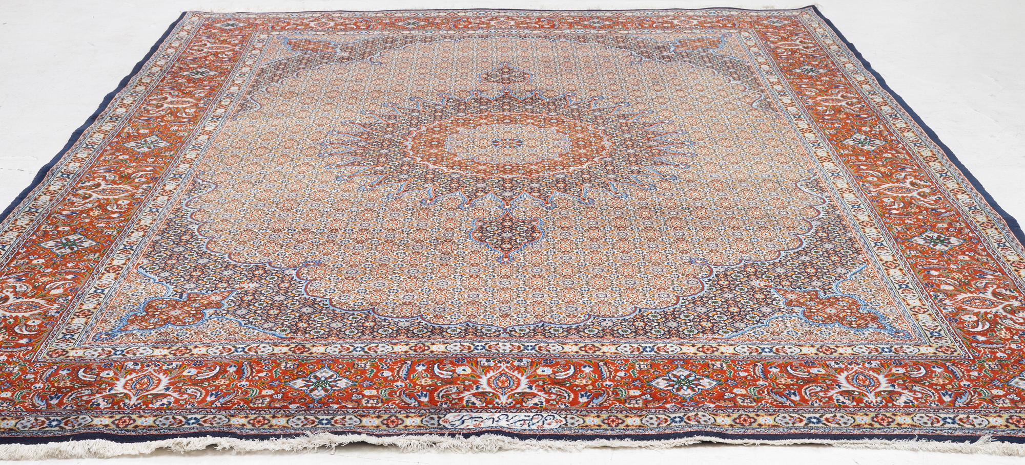 A Moud carpet, part silk, signed, c. 345 x 249 cm.