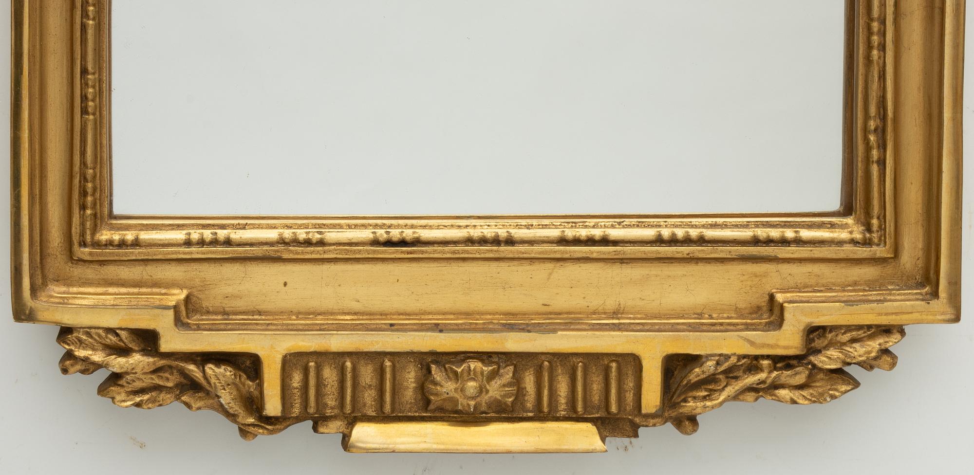 A Gustavian style mirror, mid-20th century.