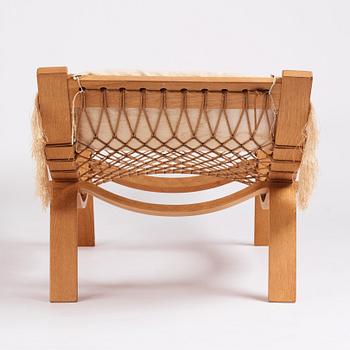 Hans J. Wegner, an oak chaise longue 'Hammock Chair GE2', Getama, Denmark, early 1960s.