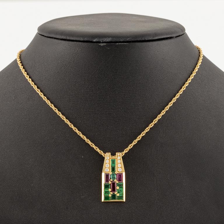 An Andrew Grima pendant in 18K gold set with step-cut emeralds, rubies and round brilliant-cut diamonds.
