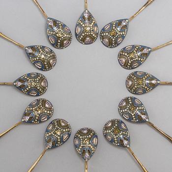 A set of twelve Fabergé silver-gilt and cloisonné enamel tea-spoons small, work master Fedor Rückert, Moscow 1908-1917.