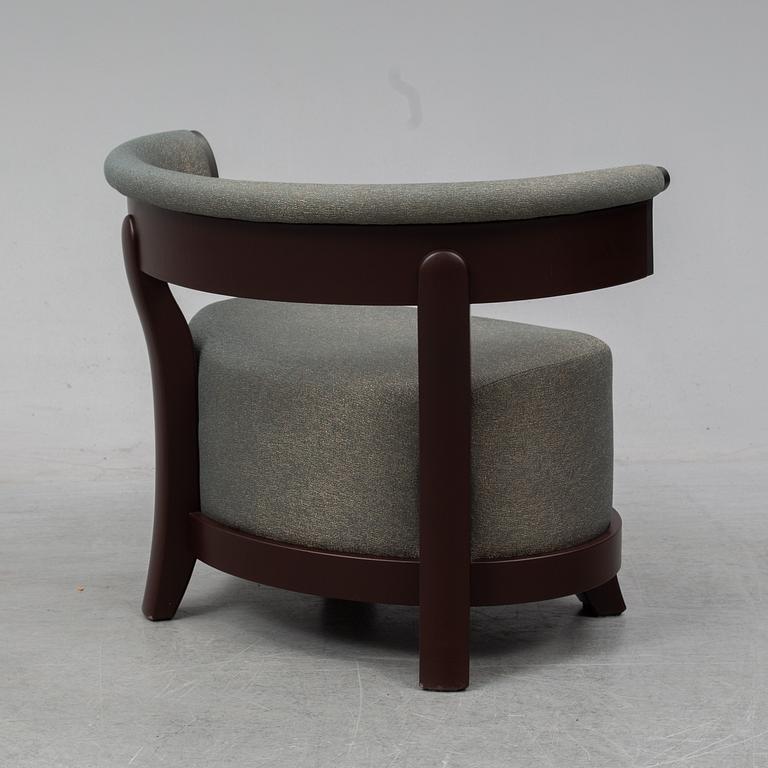 A contemporary 'Chelsea' armchair by Romeo Sozzi for Promemoria Furniture.