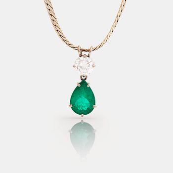 897. A brilliant cut diamond and a pear shaped emerald pendant.