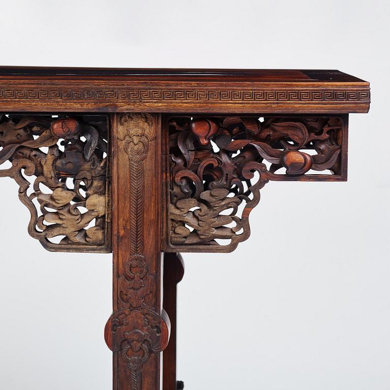 A massive zitan recessed-leg long table 'Jiaotousun Qiotouan', Qing dynasty, 19th century.