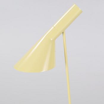 An "AJ" floor lamp, designed by Arne Jacobsen for Louis Poulsen, 21st century.