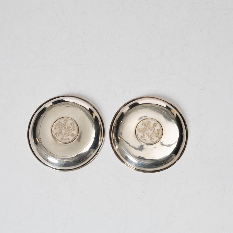 A pair of Thai silver coasters, 20th century.