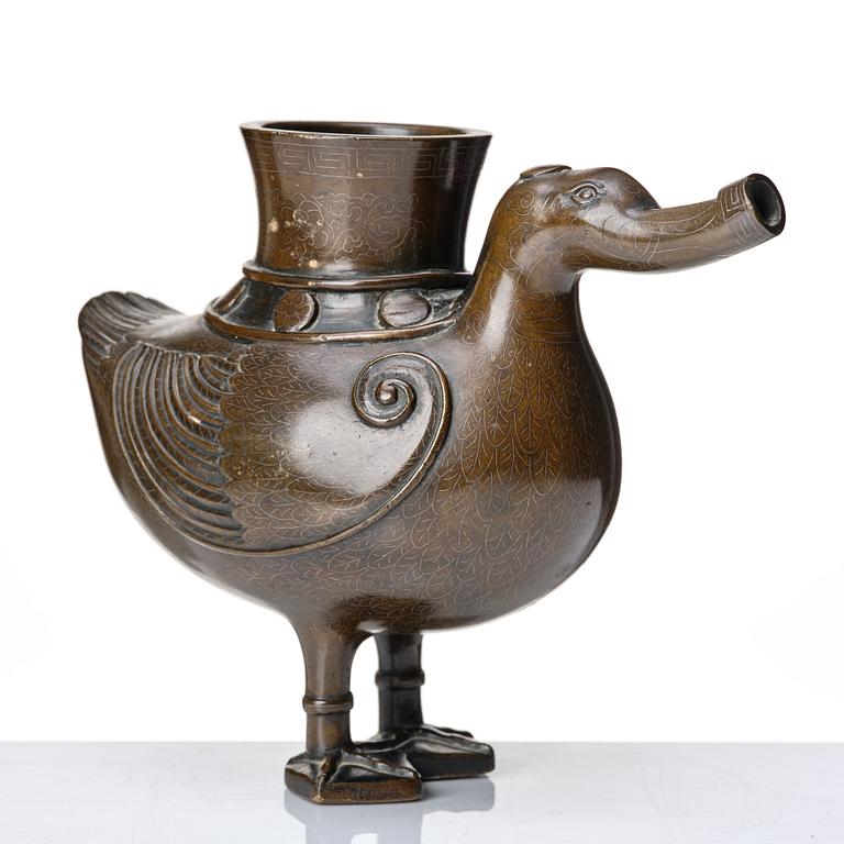 A bronze archaistic duck shaped vessel with silver inlay, Qing dynasty (1644-1912).