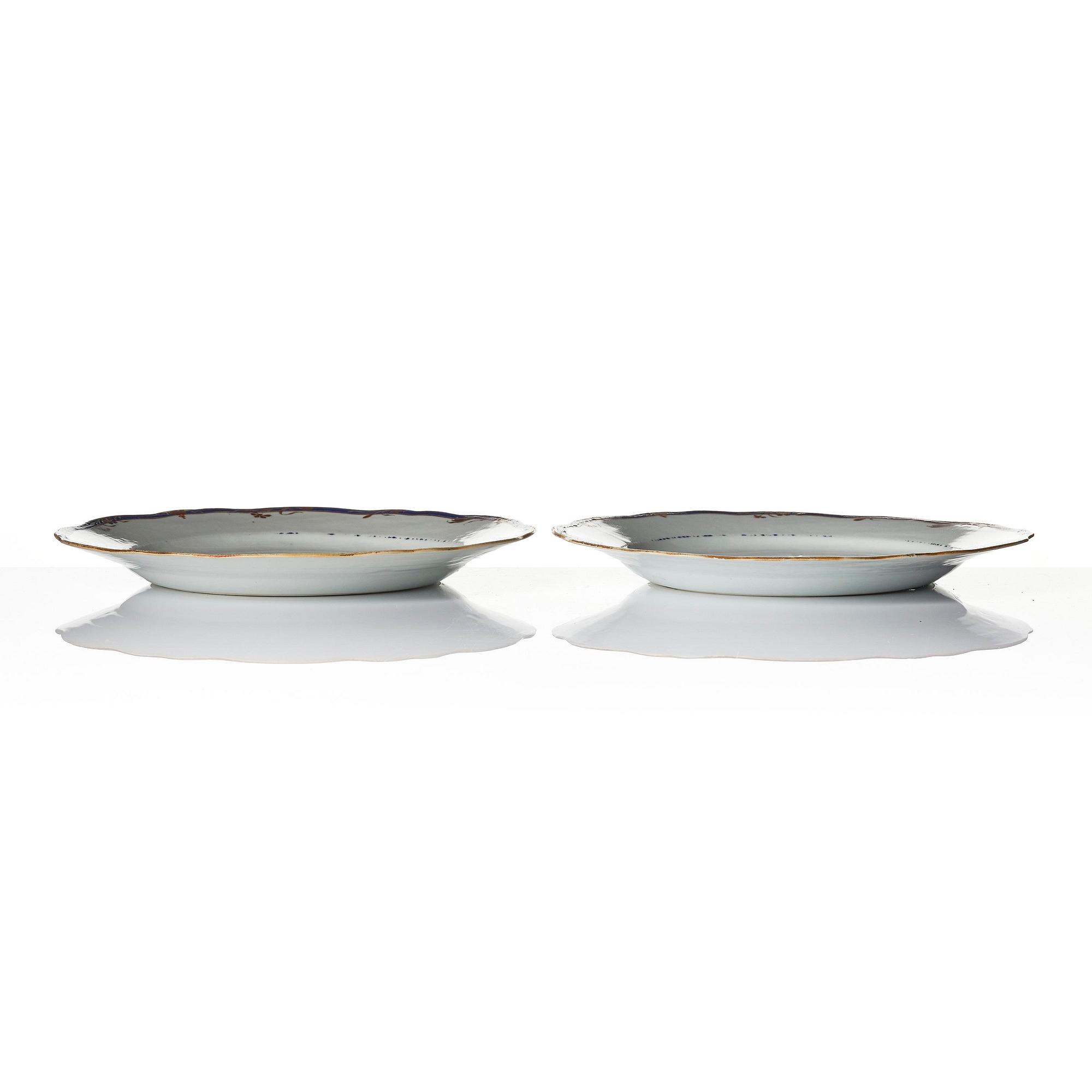 A pair of 'Chinese Export' armorial dinner plates, Qing dynasty, 1790's.