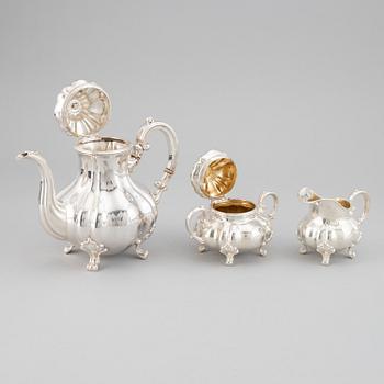 A 20th century silver coffee pot, creamer and sugar bowl. Swedish import mark.