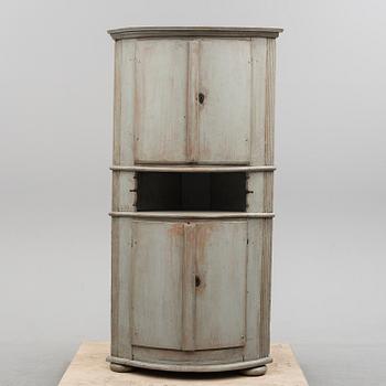 A first half of the 19th century painted corner cabinet.