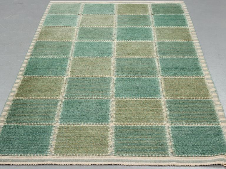 Barbro Nilsson, A carpet, "Gyllenrutan grön", knotted pile in relief ca 240,5-241,5 x 135,5-138 cm, signed AB MMF BN.