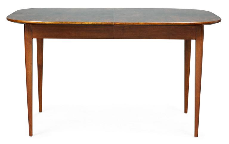 A Josef Frank walnut and mahogany dinner table, Firma Svenskt Tenn.