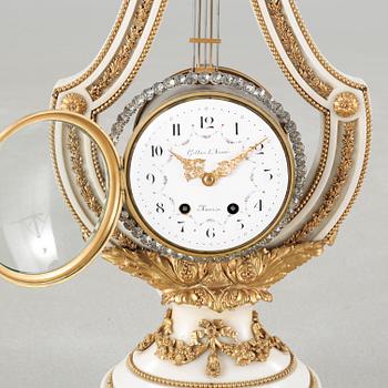 A table clock, dial marked "Gilles l'Ainé Paris", made around year 1900.