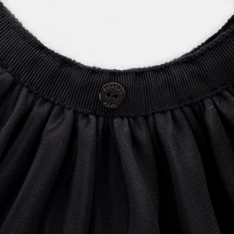 Chanel, a black silk skirt with a collar/top, size 34.