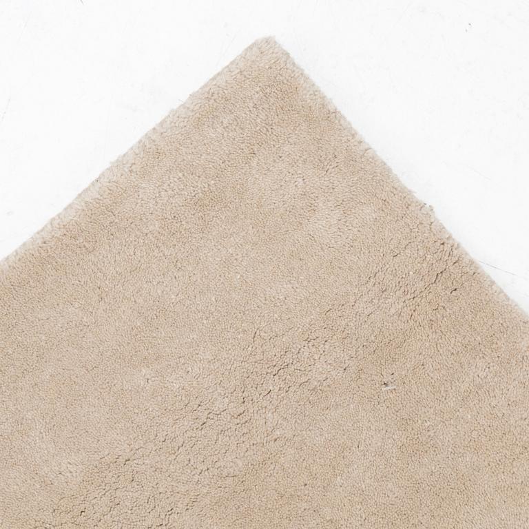 A hand tufted carpet, "Structured  Oatmeal", by lLayered ca 355 x 255 cm.