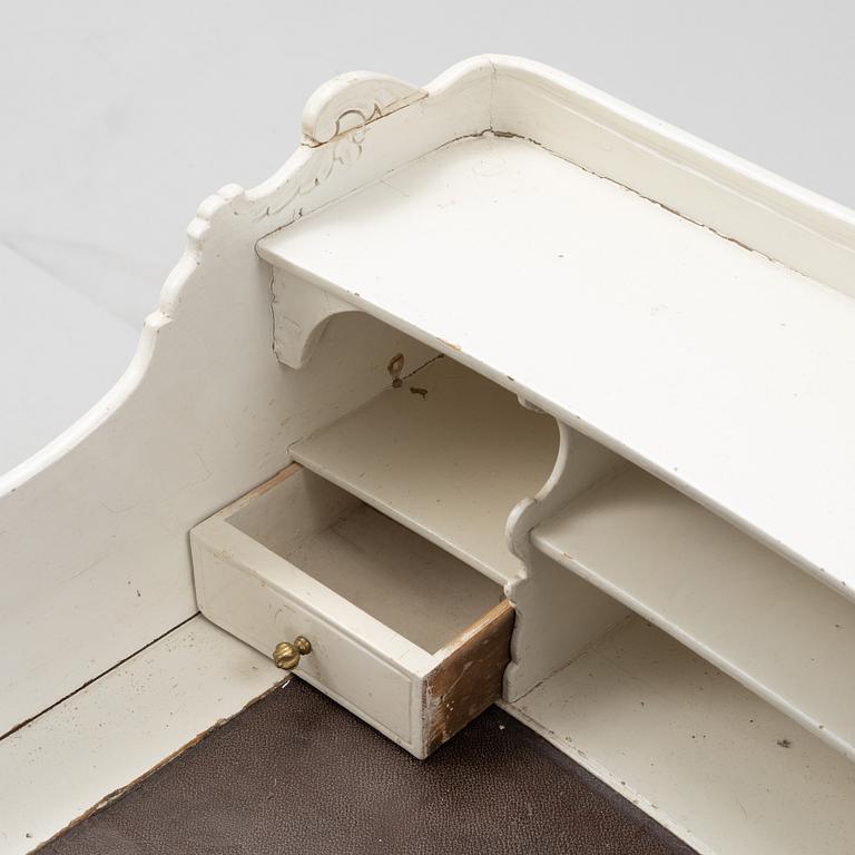 A painted rococo writing desk, mid 18th Century with later parts.