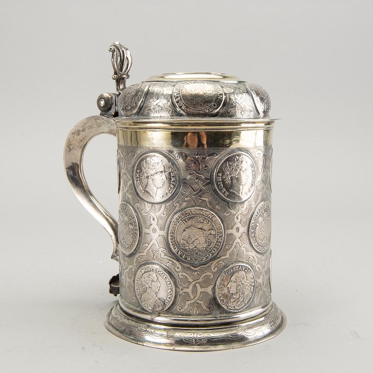 A German 18th century parcel-gilt silver coin-tankard, mark of Johann Friedrich Beyer, Schweidnitz (1736-1775).