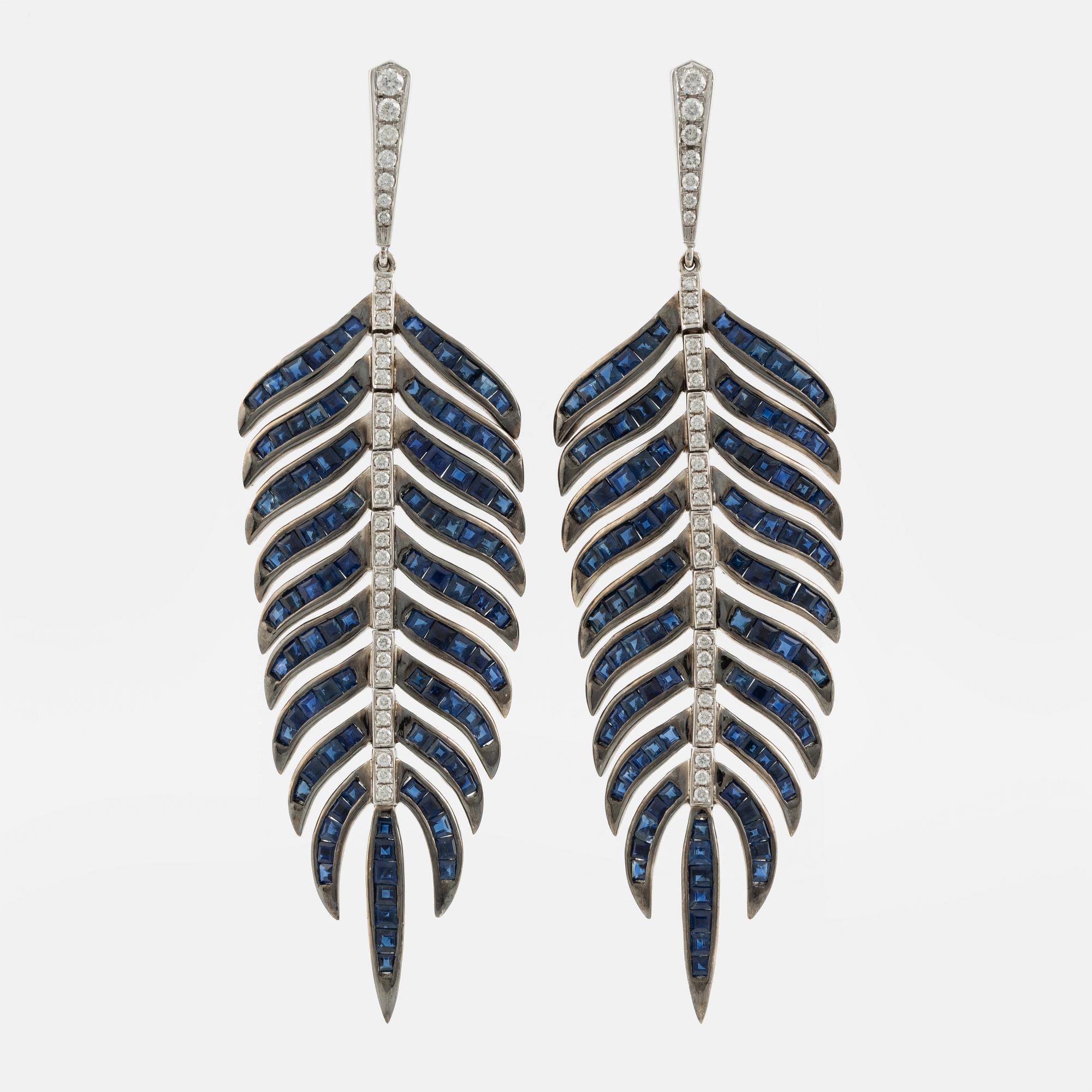 Sapphire and brilliant cut diamond feather earrings.