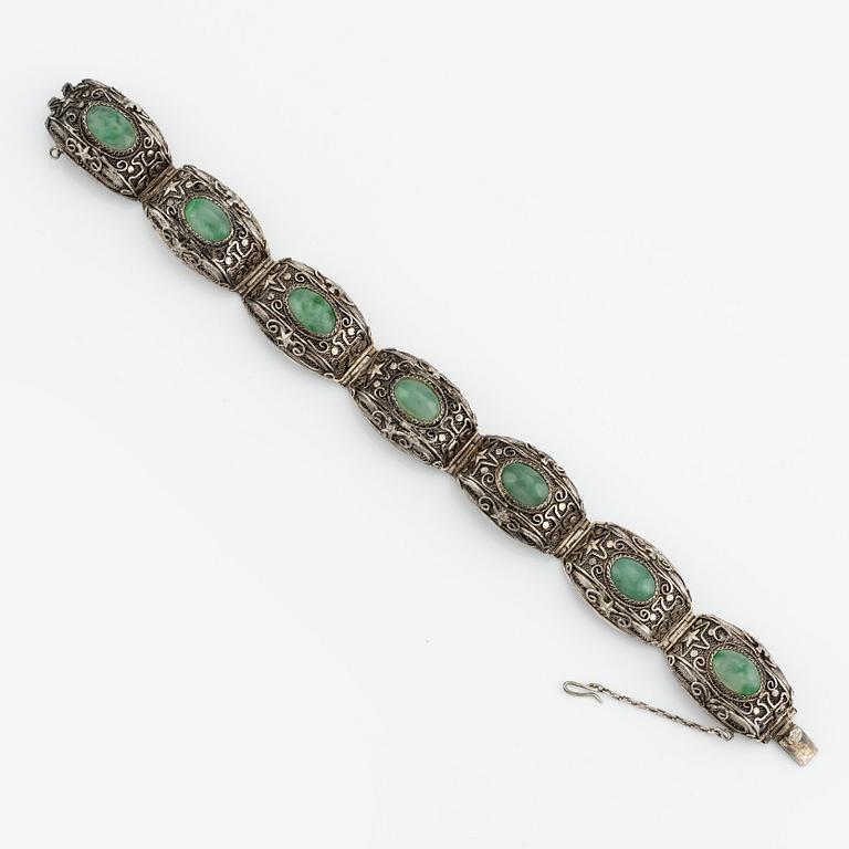 A Chinese silver and green stone bracelet and a pair of earrings, early 20th century.